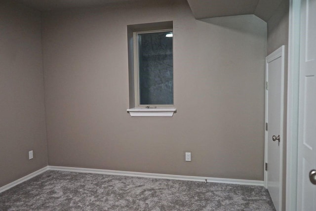 carpeted empty room with baseboards