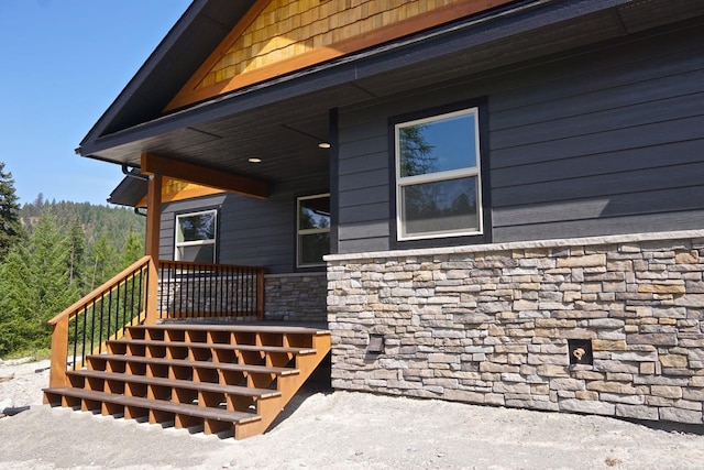 doorway to property with stone siding