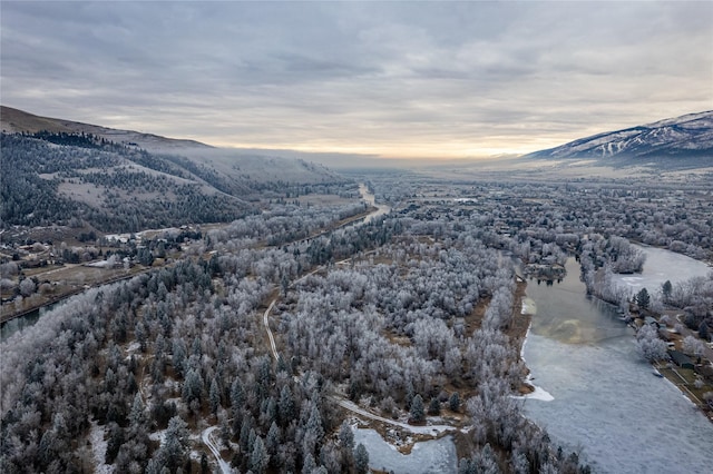 snowy aerial view featuring a mountain view