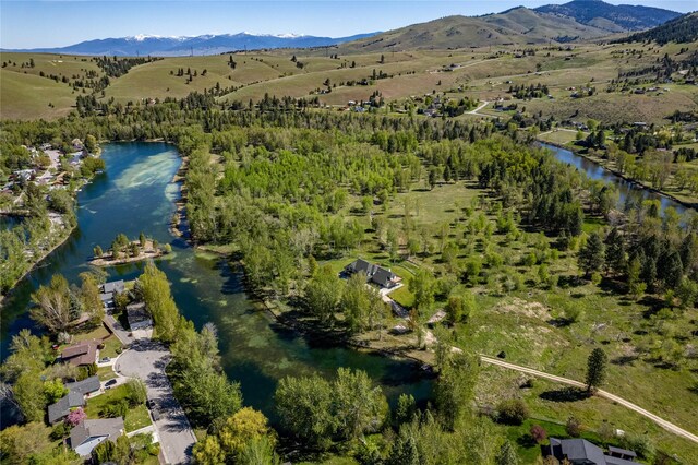 bird's eye view with a water and mountain view