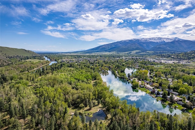 drone / aerial view with a water and mountain view