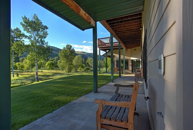 view of patio / terrace with a mountain view