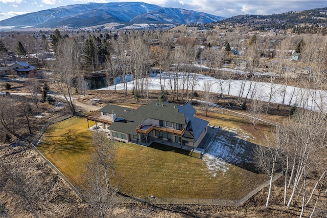 snowy aerial view featuring a mountain view