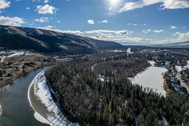 birds eye view of property with a water and mountain view