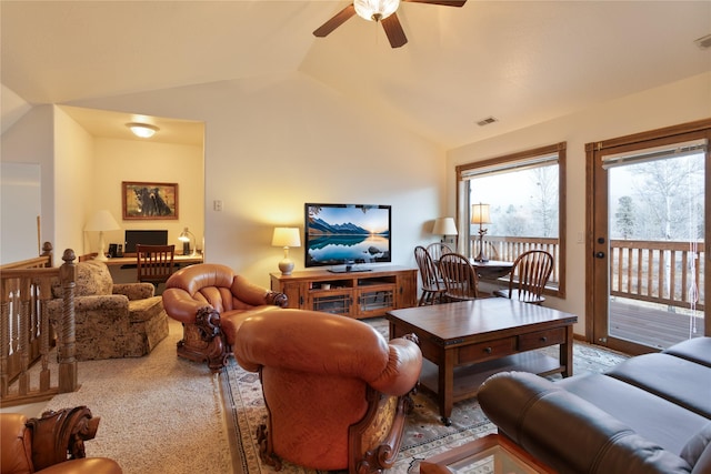 carpeted living room featuring ceiling fan and vaulted ceiling