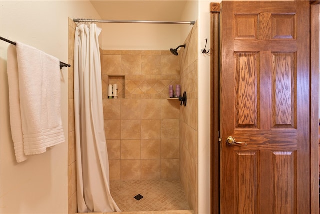 bathroom featuring a shower with curtain