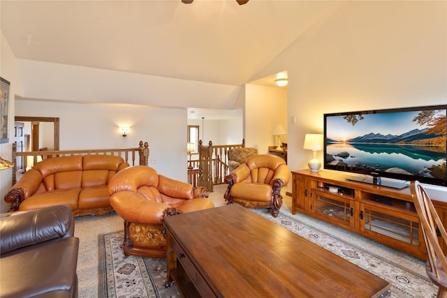 living room with carpet and vaulted ceiling