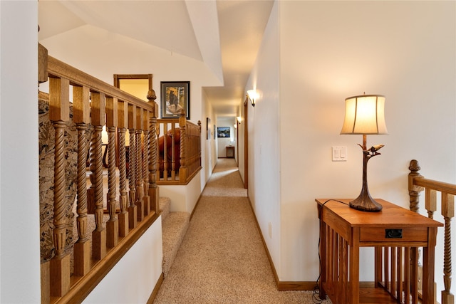 corridor featuring carpet flooring and lofted ceiling