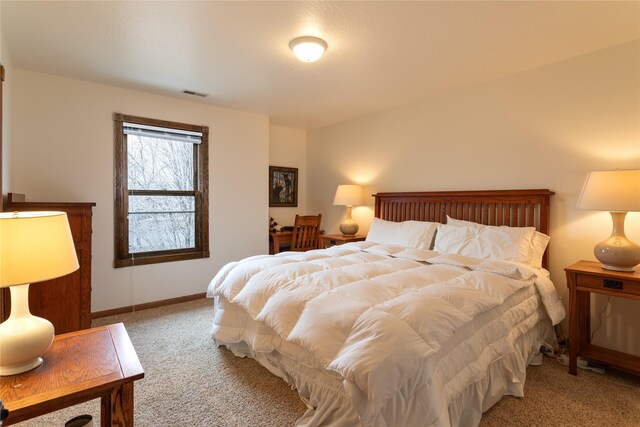 bedroom with light colored carpet