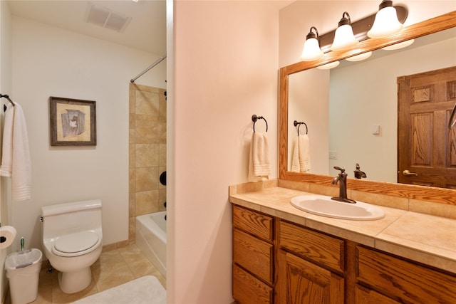 full bathroom with toilet, vanity, tile patterned floors, and tiled shower / bath