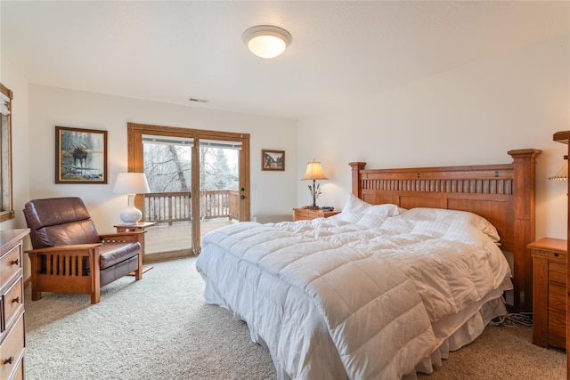 carpeted bedroom featuring access to exterior