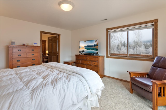 bedroom featuring light carpet