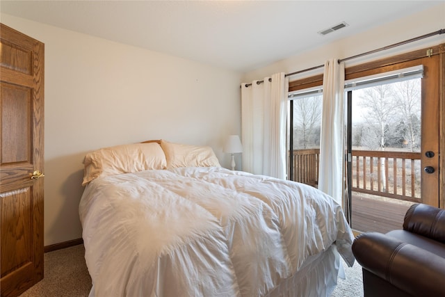 carpeted bedroom featuring access to exterior