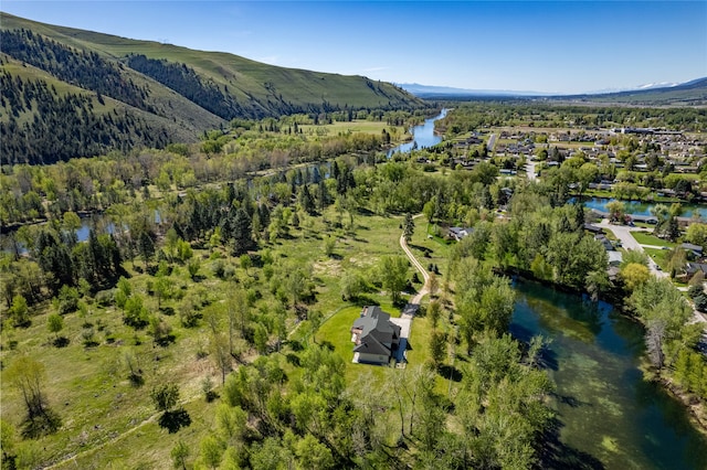 aerial view featuring a water and mountain view