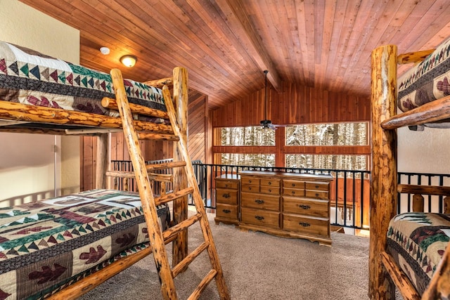 carpeted bedroom featuring lofted ceiling with beams and wood ceiling