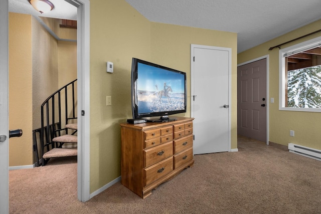 carpeted bedroom with a textured ceiling