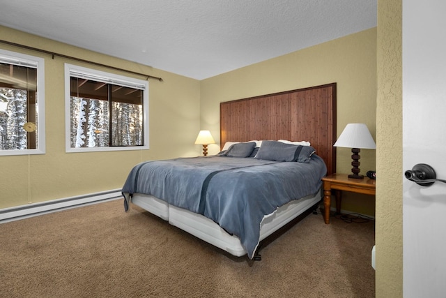 105 Cedar Way Unit 105, Whitefish, MT 59937 - bedroom featuring carpet floors, a baseboard radiator, and a textured ceiling