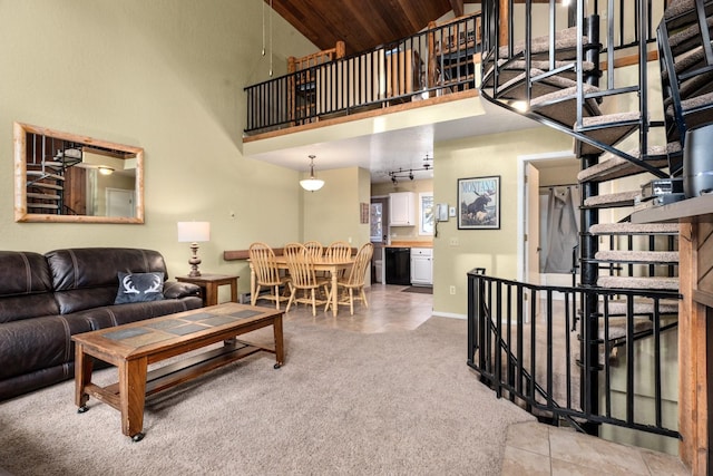 living room featuring high vaulted ceiling and wood ceiling