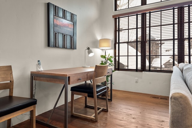 office space with hardwood / wood-style flooring