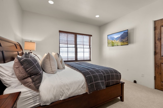 bedroom with light carpet