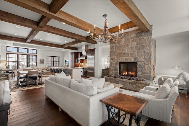 living room with coffered ceiling, a chandelier, dark hardwood / wood-style floors, a fireplace, and beam ceiling