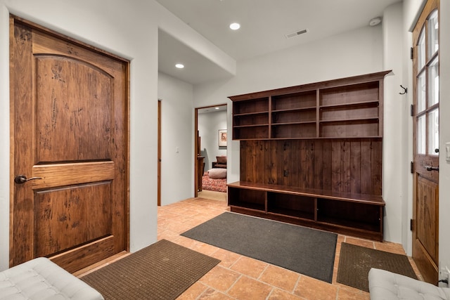 mudroom featuring light tile floors