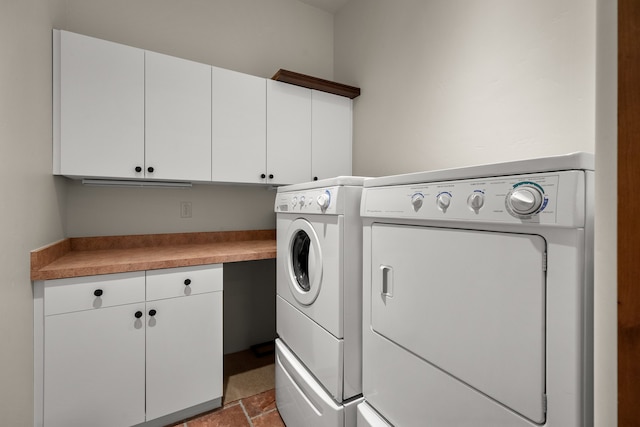 clothes washing area featuring independent washer and dryer, cabinets, and dark tile flooring