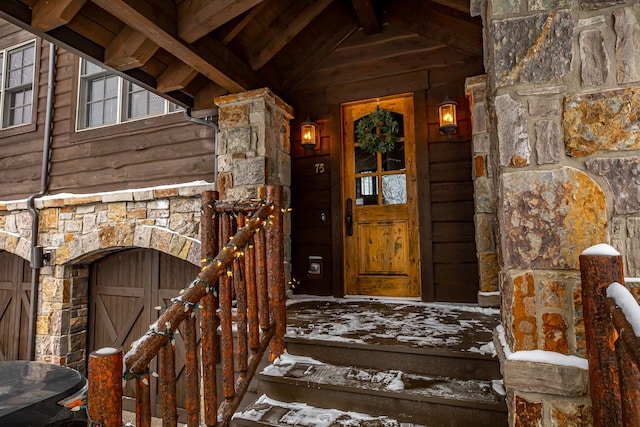 view of snow covered property entrance