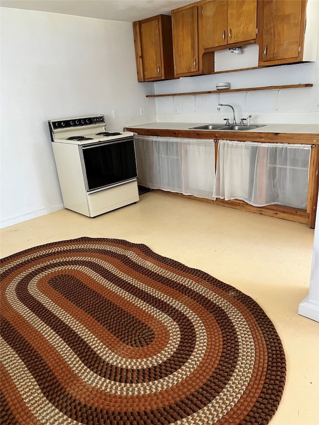 kitchen with white electric range and sink