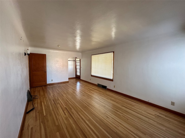 spare room featuring hardwood / wood-style flooring