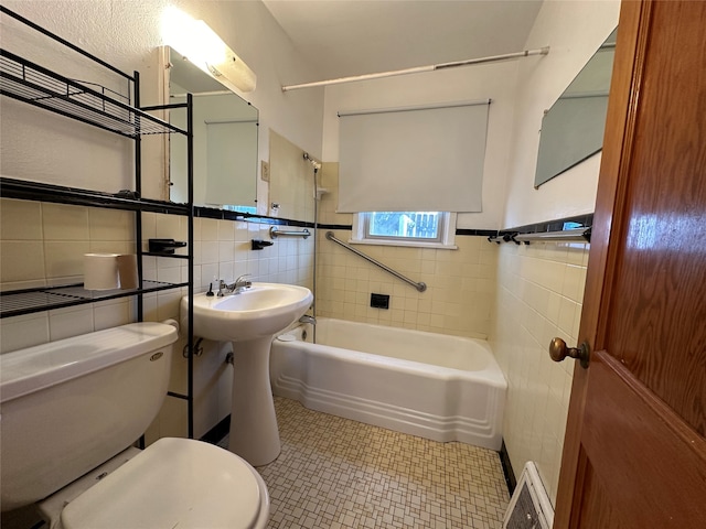 bathroom featuring tile floors, backsplash, toilet, and tile walls