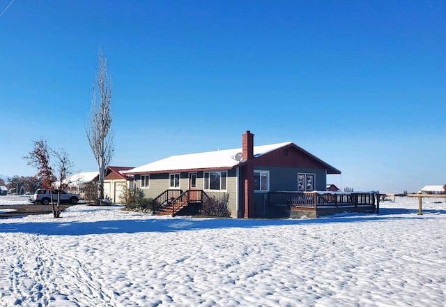 single story home featuring a deck