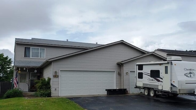 1996/1998 Greatview Ave, Kalispell, MT 59901 - traditional-style home with driveway, a garage, and a front lawn