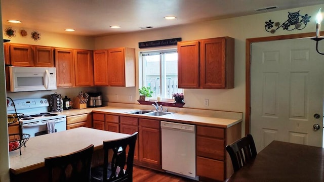 1996/1998 Greatview Ave, Kalispell, MT 59901 - kitchen featuring white appliances, light countertops, wood finished floors, and recessed lighting