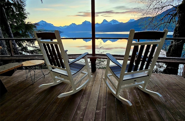 view of dock featuring a deck with mountain view