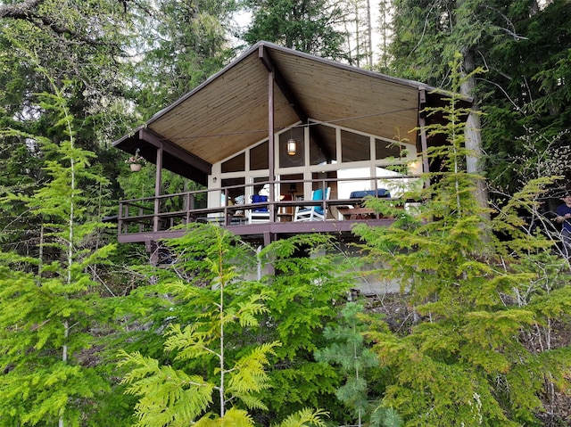 back of house featuring a wooden deck