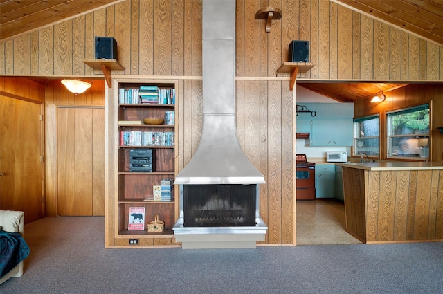 carpeted living room with lofted ceiling, sink, wooden ceiling, and a wood stove