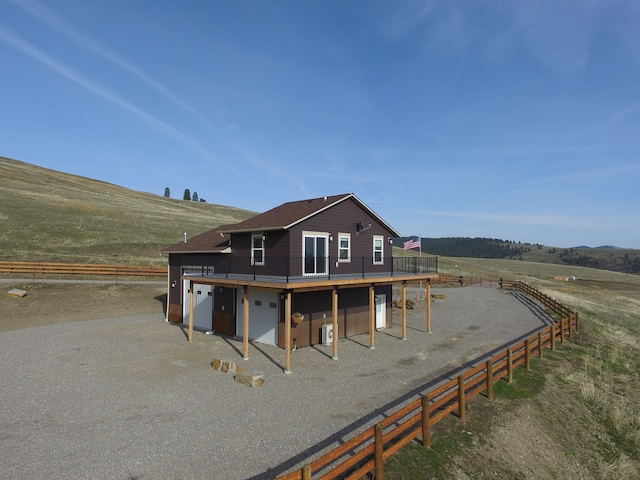 rear view of property featuring a rural view