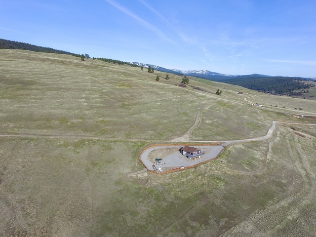 birds eye view of property with a rural view