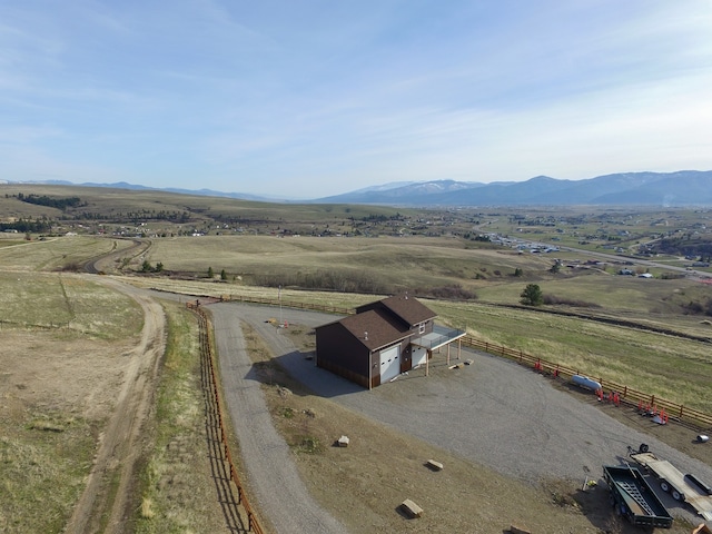 birds eye view of property with a rural view and a mountain view