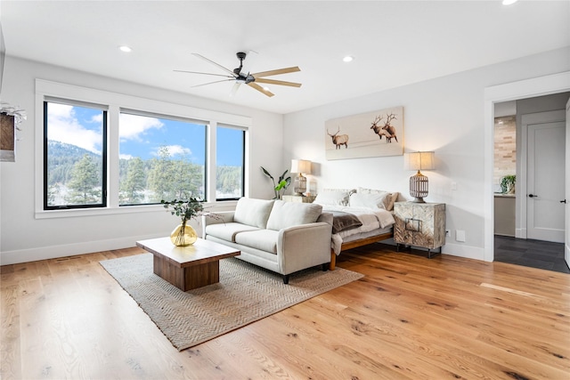 bedroom featuring ceiling fan and light wood-type flooring