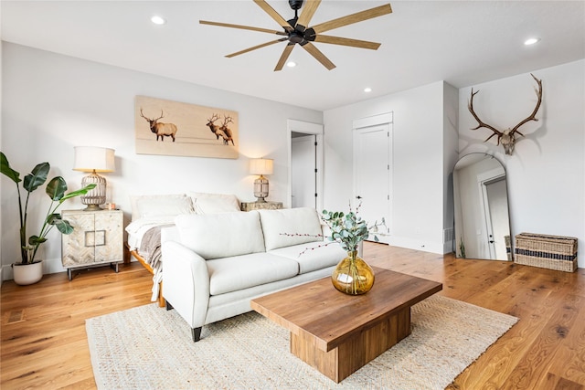 bedroom with ceiling fan and light hardwood / wood-style floors