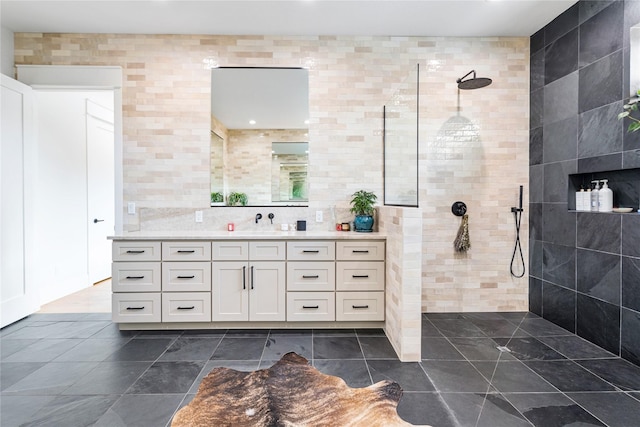 bathroom featuring walk in shower and vanity