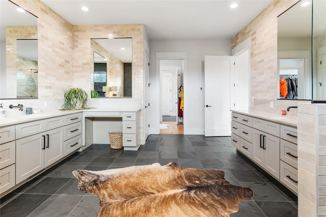 bathroom featuring vanity and decorative backsplash