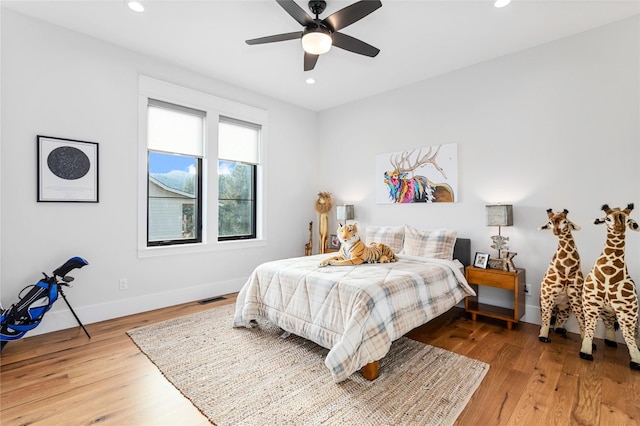 bedroom featuring ceiling fan and hardwood / wood-style flooring