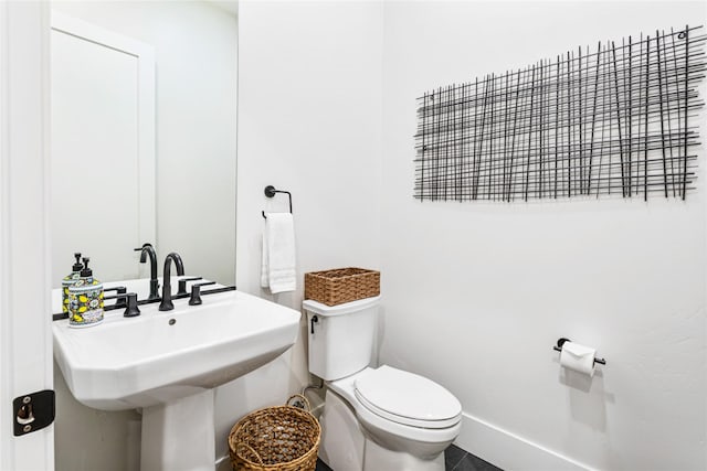 bathroom with toilet and sink