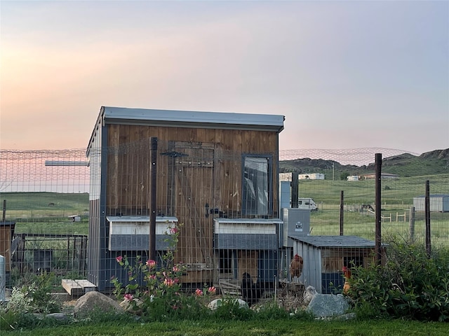 view of outdoor structure at dusk