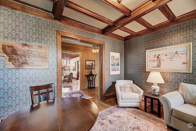 living area with wood-type flooring, beam ceiling, and coffered ceiling