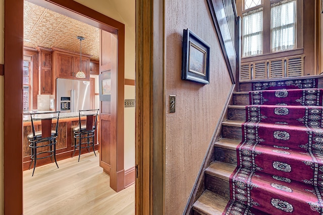 staircase with light hardwood / wood-style flooring