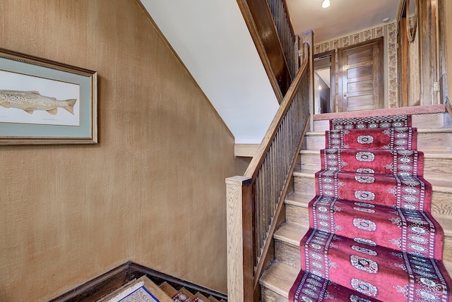 stairs with hardwood / wood-style floors